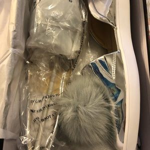 Never worn shoes with fur puff on top